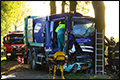 Chauffeur vuilniswagen bekneld na aanrijding met tractor [+foto]